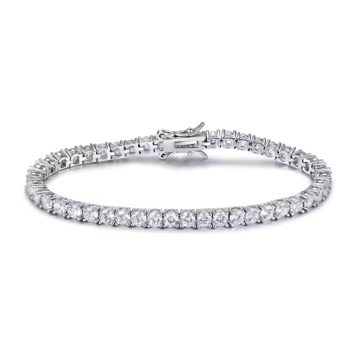 A tennis bracelet featuring natural round cut diamonds, with a white gold or platinum metal band and two secure locking mechanisms.