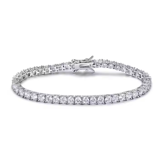 A tennis bracelet featuring natural round cut diamonds, with a white gold or platinum metal band and two secure locking mechanisms.