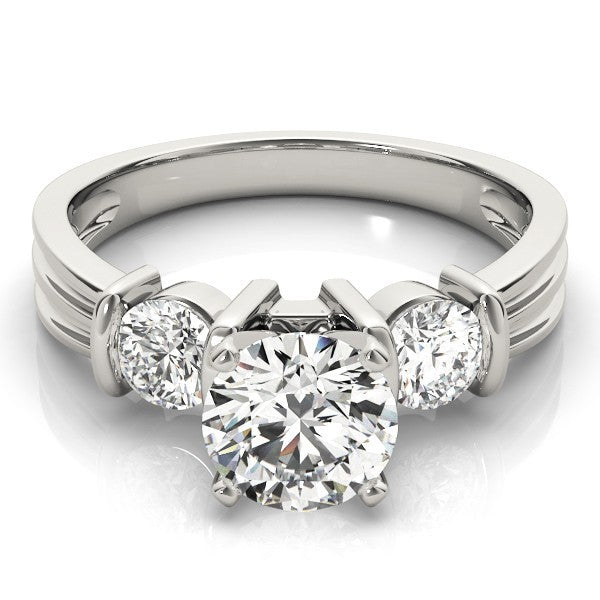 Diamond ring with three clear gemstones on a white background
