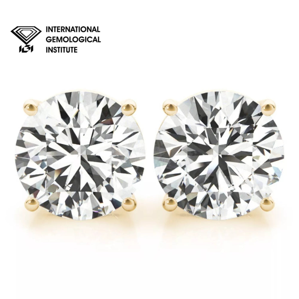 Pair of diamond earrings with International Gemological Institute logo.