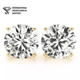 Pair of diamond earrings with International Gemological Institute logo.