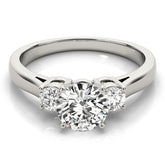 Diamond ring with three heart-shaped diamonds on a white background