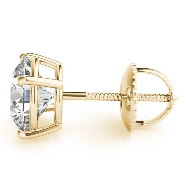 Gold earring with a clear gemstone on a white background