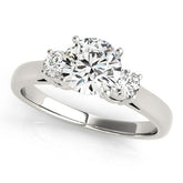 Diamond ring with three clear gemstones on a white background