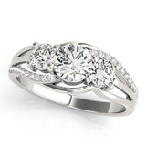 Three-stone diamond ring on a white background