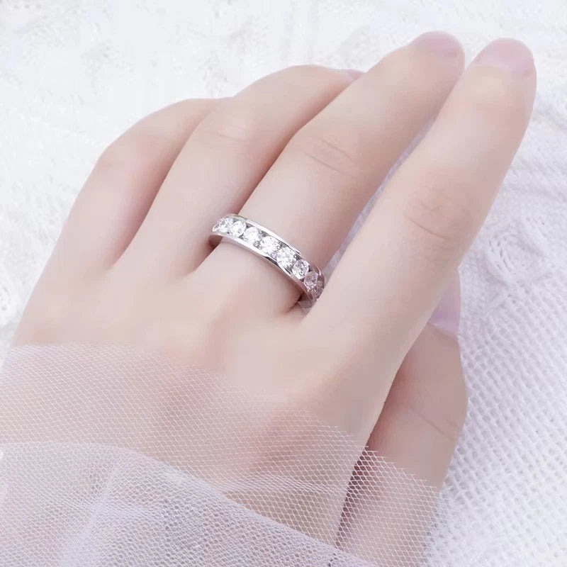 Silver ring with gemstones on a hand