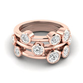 Rose gold ring with diamond stones on a white background