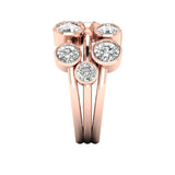 Rose gold ring with multiple diamonds on a white background