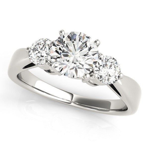 Three-stone diamond ring on a white background