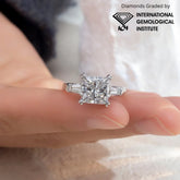 Diamond ring on a finger with International Gemological Institute logo