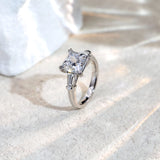 Silver ring with a diamond on a light background
