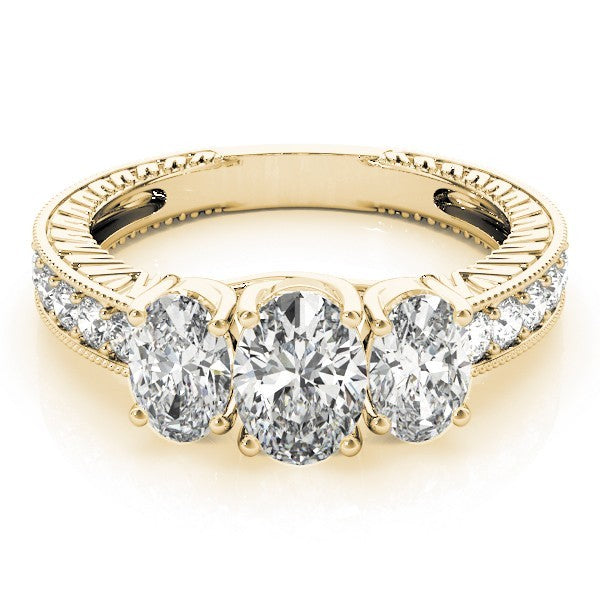 Gold ring with three diamonds on a white background