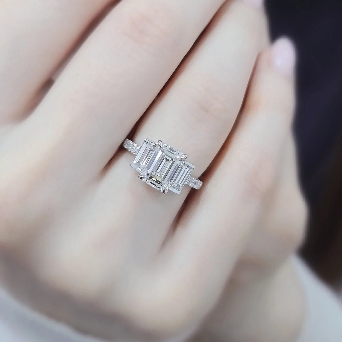 Silver ring with a large diamond on a hand