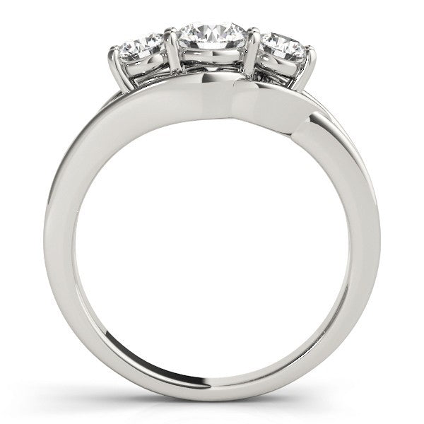 Diamond ring with three stones on a white background