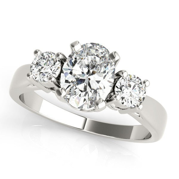 Diamond ring with three stones on a white background