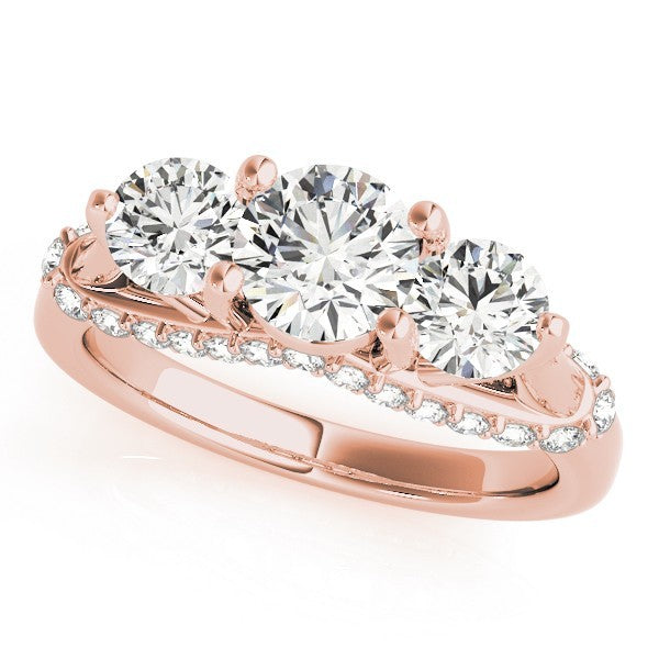 Rose gold ring with three circular diamonds on a white background