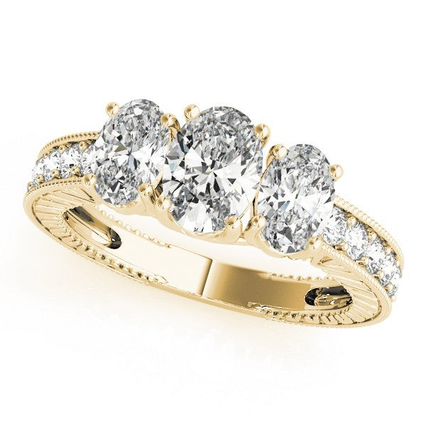 Gold ring with oval-shaped diamonds on a white background