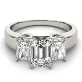 Diamond ring with three rectangular-cut diamonds on a white background
