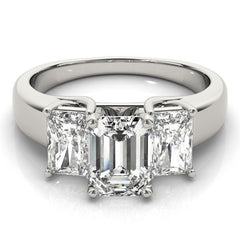 Diamond ring with three rectangular-cut diamonds on a white background