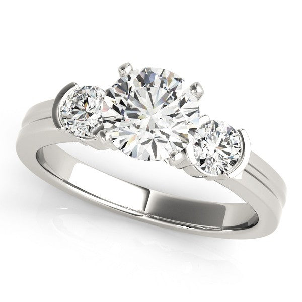 Three-stone diamond ring on a white background