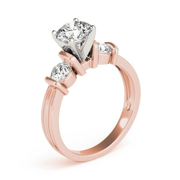 Rose gold ring with three diamonds on a white background