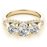Gold ring with three diamonds on a white background
