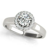 Elegant round cut diamond halo engagement ring in platinum setting.