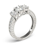 Silver ring with three diamonds on a white background