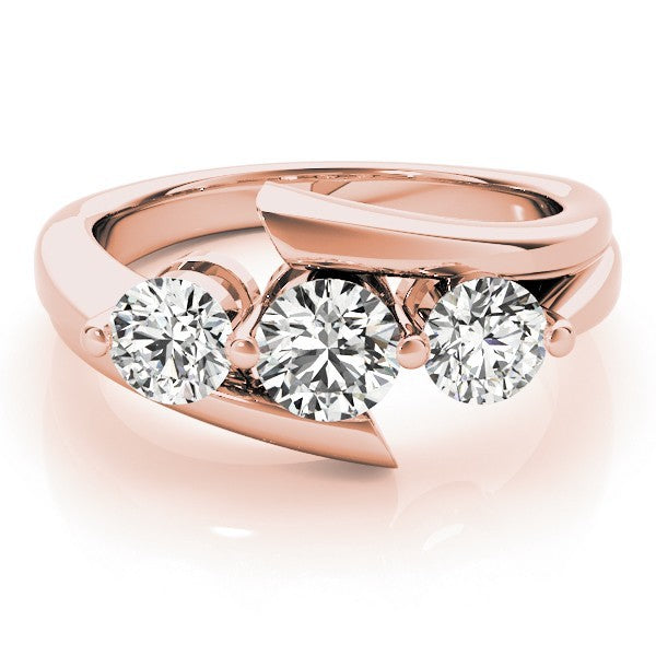 Rose gold ring with three diamonds on a white background