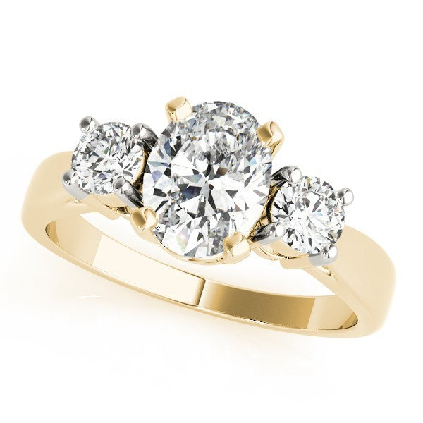 Gold ring with three diamonds on a white background