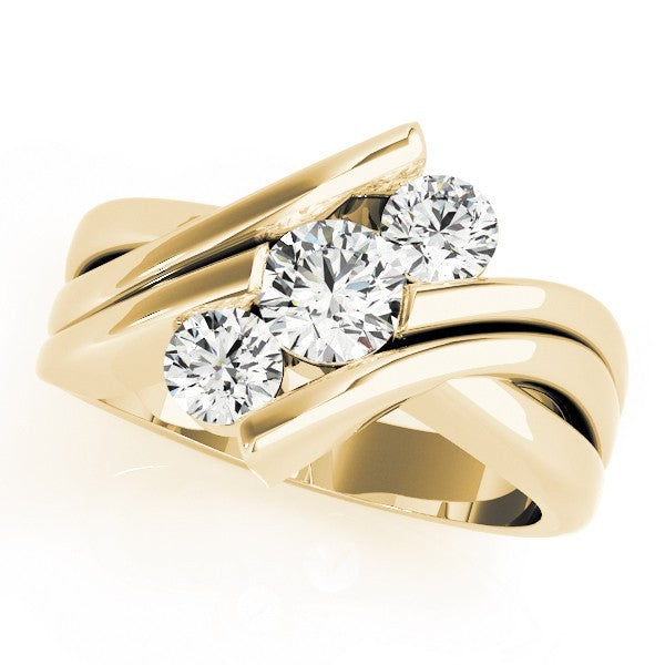 Gold ring with three diamonds on a white background