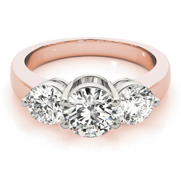 Rose gold ring with three diamond stones on a white background