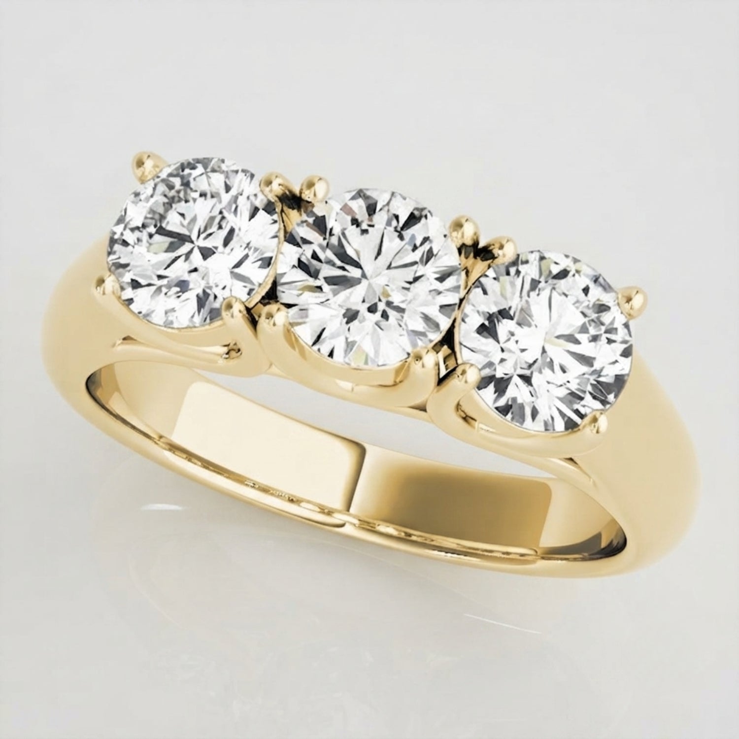 Delicate 0.50Ct round diamond trilogy engagement ring designed for a classic minimalist look.