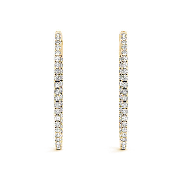 Gold hoop earrings with diamond accents on a white background