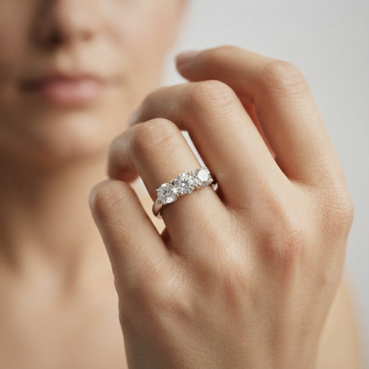 Stunning 1.00Ct three-stone lab-grown diamond ring featuring perfectly matched round brilliant centre and side stones.