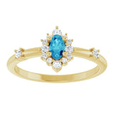 Oval Blue Zircon Halo Ring with Diamond Accents in Yellow Gold