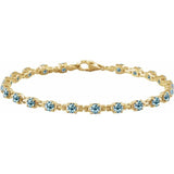 Round Natural Sky Blue Topaz Line Bracelet In Gold & Platinum