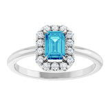 Emerald Blue Zircon & Diamond Halo Ring in Gold and Platinum