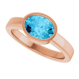 Oval Aquamarine Solitaire Ring in Gold and Platinum