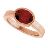 Oval Mozambique Garnet Solitaire Ring in Gold and Platinum
