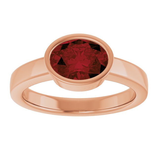 Oval Mozambique Garnet Solitaire Ring in Gold and Platinum