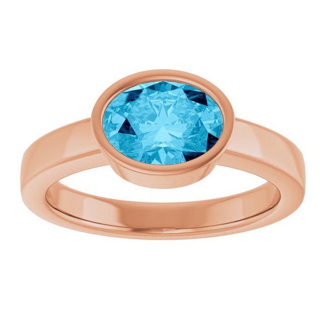 Oval Aquamarine Solitaire Ring in Gold and Platinum