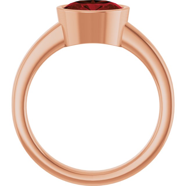 Oval Mozambique Garnet Solitaire Ring in Gold and Platinum