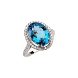 Oval Swiss Blue Topaz Halo Ring with Diamond Accents in White Gold