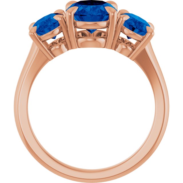 Oval Lab-Grown Blue Sapphire Three Stone Ring in Gold and Platinum
