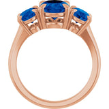 Oval Lab-Grown Blue Sapphire Three Stone Ring in Gold and Platinum