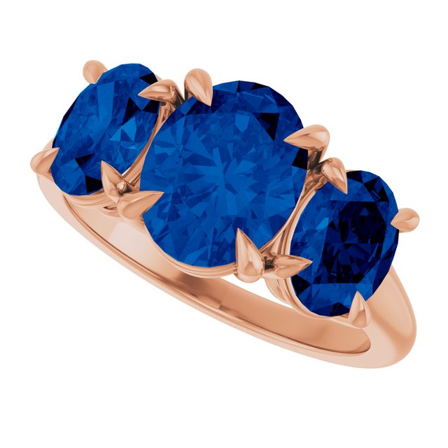 Oval Lab-Grown Blue Sapphire Three Stone Ring in Gold and Platinum