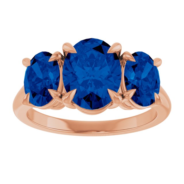 Oval Lab-Grown Blue Sapphire Three Stone Ring in Gold and Platinum