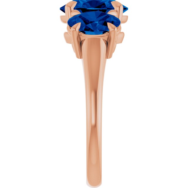 Oval Lab-Grown Blue Sapphire Three Stone Ring in Gold and Platinum