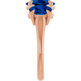 Oval Lab-Grown Blue Sapphire Three Stone Ring in Gold and Platinum